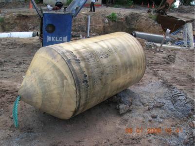 Laying amour rock for slope protection at platform