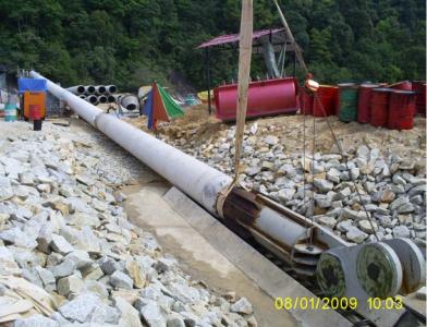 Laying amour rock for slope protection at platform