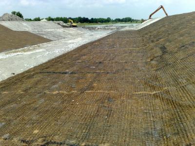 Laying Fibromat to prepare for hydroseeding